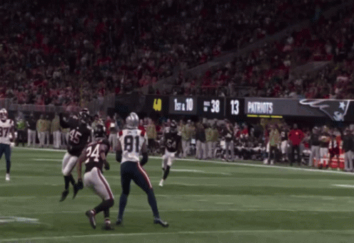 a football game between the patriots and the ravens is going on