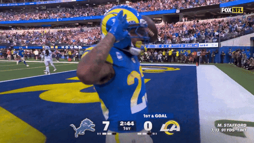 A Football Game Between The Rams And Detroit Lions GIF