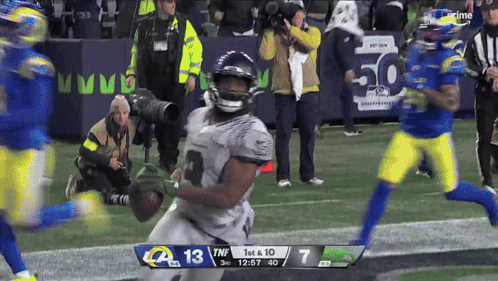 a football game between the rams and the seahawks is being played