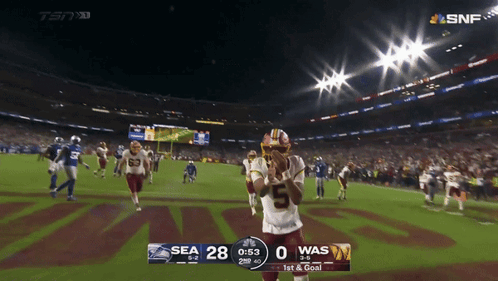 A Football Game Between The Seahawks And The Was GIF