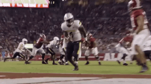 A Football Game Is Being Played Between The Alabama And Florida State Teams GIF