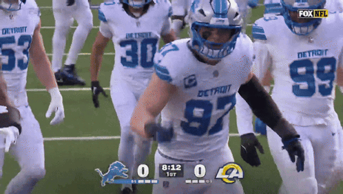 a football game is being played between the detroit lions and los angeles rams