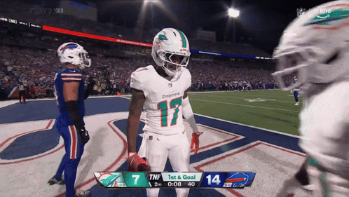 A Football Game Is Being Played Between The Dolphins And Bills GIF
