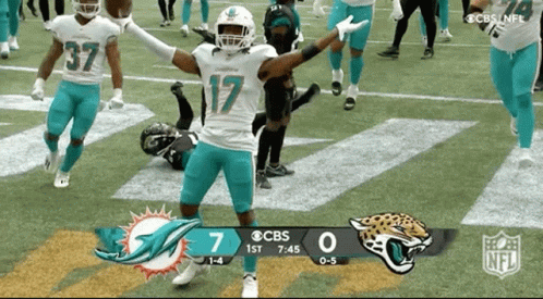 A Football Game Is Being Played Between The Dolphins And Jaguars GIF