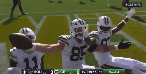 A Football Game Is Being Played Between The Green Bay Packers And The Hous GIF