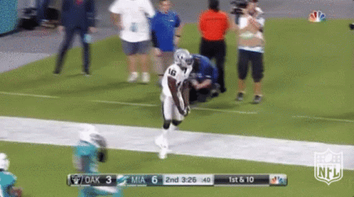 A Football Game Is Being Played Between The Raiders And The Dolphins GIF