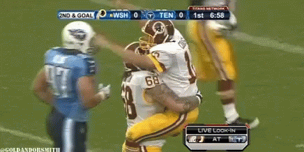 A Football Game Is Being Played Between The Redskins And The Titans GIF