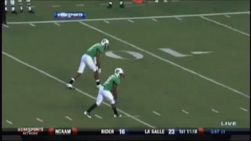 A Football Game Is Being Played In Front Of A Pepsi Banner GIF