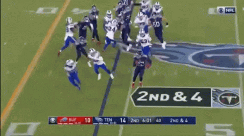 A Football Game Is Being Played On A Field And A Player Is Being Lifted By A Target . GIF