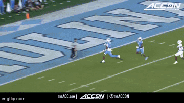 a football game is being played on a field that has the word accn on it