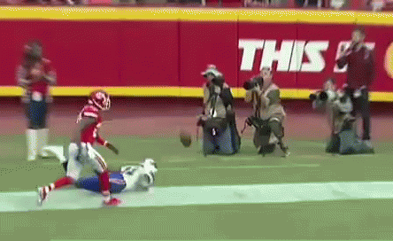 A Football Game Is Being Played On A Field With A Banner That Says This On It GIF