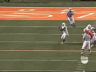 a football game is being played on a field with tbs written on the sidelines