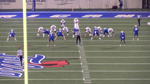 A Football Game Is Being Played On A Field With The Number 50 On The Sidelines GIF