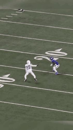 A Football Game Is Being Played On A Field With The Number 6 On The Sideline GIF