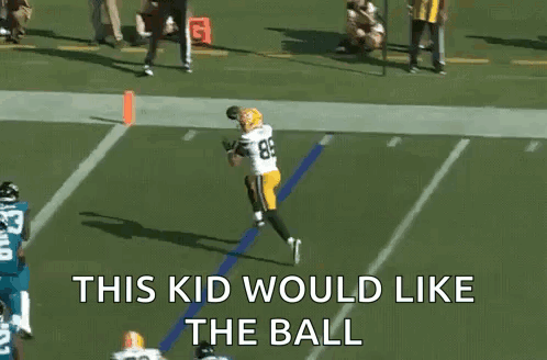 a football player catching a ball with the words this kid would like the ball