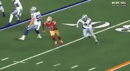 A Football Player In A 49Ers Uniform Is Running Down The Field GIF