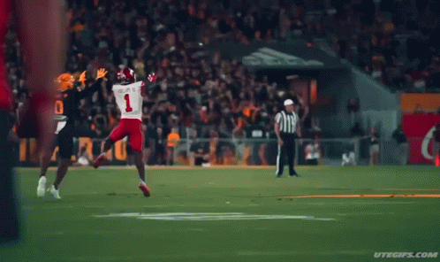 A Football Player In A Black Jersey With The Number 0 On It GIF