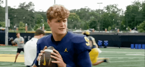 A Football Player In A Blue Jersey With The Number 3 On It GIF