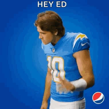 A Football Player In A Blue Jersey With The Number 5 On It GIF