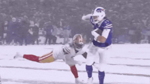 A Football Player In A Buffalo Bills Jersey Is Running With The Ball GIF