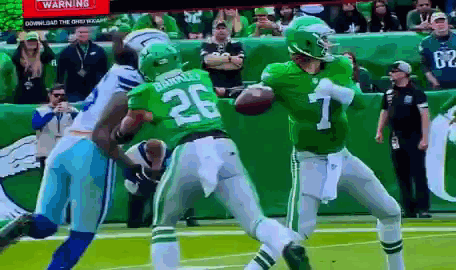 A Football Player In A Green Uniform With The Number 26 On It GIF
