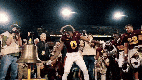 A Football Player In A Maroon Uniform With The Number 9 On It GIF