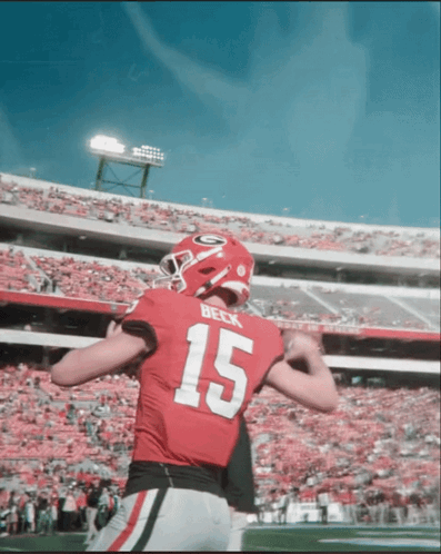 A Football Player In A Red Jersey With The Number 15 On It GIF