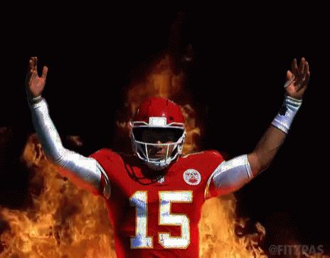 a football player in a red jersey with the number 15 on it