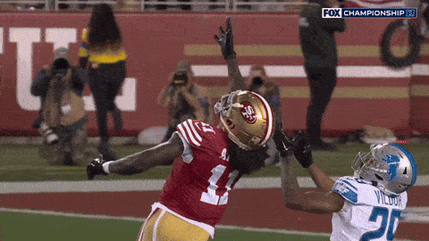 A Football Player In A Red Jersey With The Number 41 On It GIF