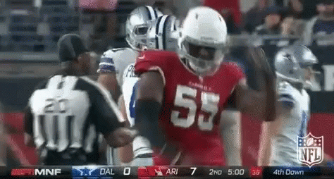 A Football Player In A Red Jersey With The Number 55 On It GIF