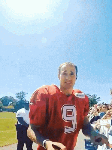 A Football Player In A Red Jersey With The Number 9 On It GIF