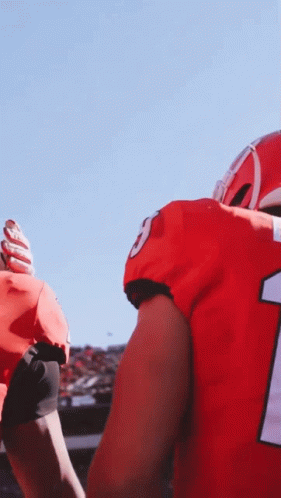 a football player in a red uniform with the number 1 on it