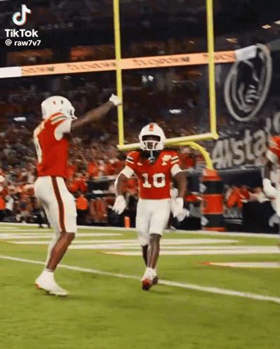 A Football Player In A Red Uniform With The Number 10 On It GIF