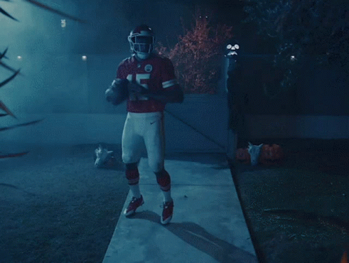 A Football Player In A Red Uniform With The Number 7 On It GIF