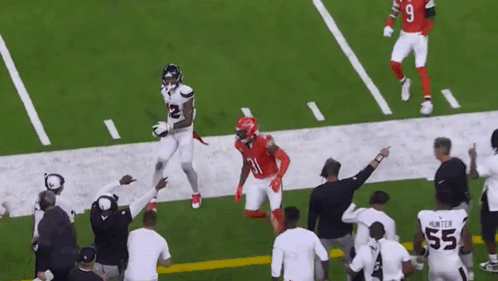 A Football Player In A White Jersey With The Number 12 On It GIF