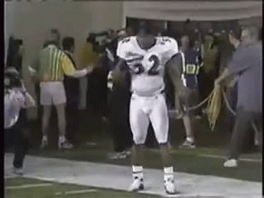 A Football Player In A White Uniform With The Number 32 On It GIF