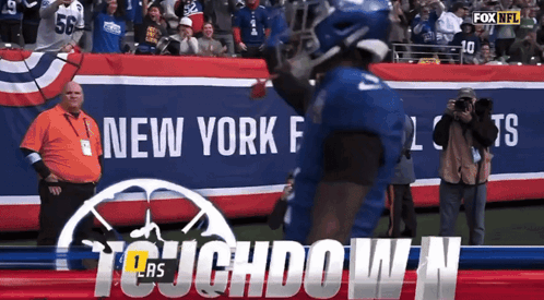 A Football Player In Front Of A Banner That Says Fox Nfl GIF