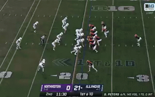 A Football Player Is Being Carried Off The Field By A Nurse . GIF