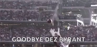 A Football Player Is Catching A Ball In A Stadium With The Words `` Goodbye Dez Bryant '' . GIF