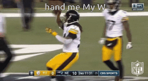 A Football Player Is Jumping In The Air With The Words Hand Me My W Above Him GIF