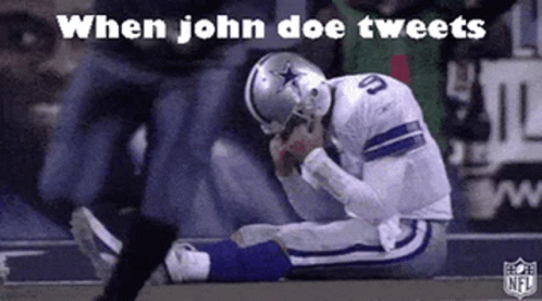 A Football Player Is Kneeling Down On The Field With His Head Down . GIF