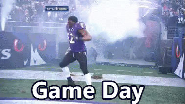A Football Player Is Running On A Field With The Words Game Day Written Below Him GIF