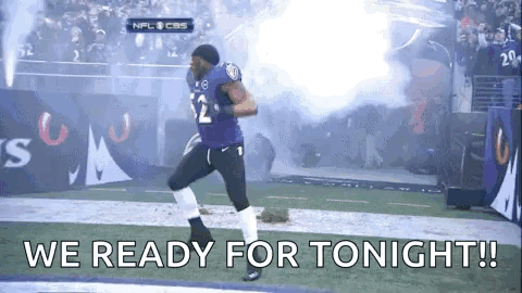 A Football Player Is Running On A Field With The Words `` We Ready For Tonight '' Written On It . GIF