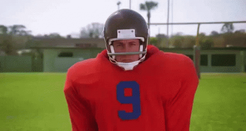 A Football Player Is Wearing A Red Jersey With The Number 9 On It GIF