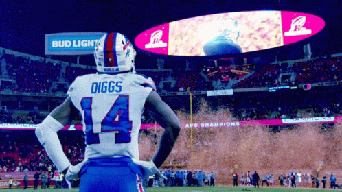 A Football Player Named Diggs Is Standing In Front Of A Bud Light Sign GIF