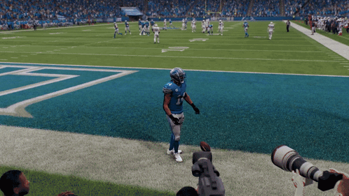 a football player wearing a blue jersey with the number 1 on it