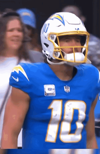 A Football Player Wearing A Blue Jersey With The Number 10 GIF