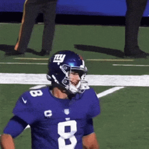 A Football Player Wearing A Blue Jersey With The Number 8 GIF