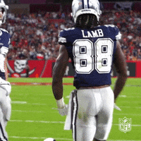 A Football Player Wearing A Blue Jersey With The Number 88 On It GIF