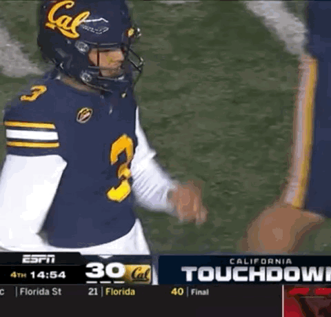 A Football Player Wearing A California Jersey Talks To Another Player GIF